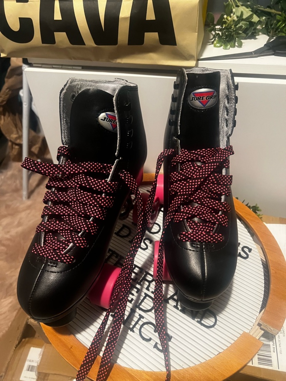 Black Sure Grip Roller Skates with Pink Accents